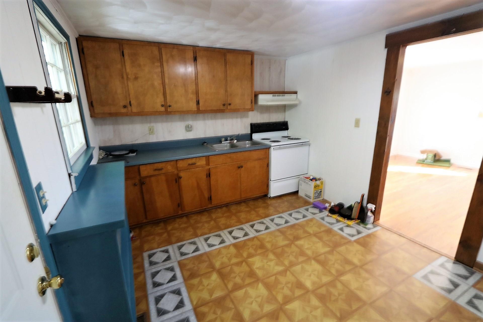 174 Spring Dale Road Southwest Floyd, VA 24091 - Photo 32 of 37 a kitchen with stainless steel appliances a stove a sink and a refrigerator