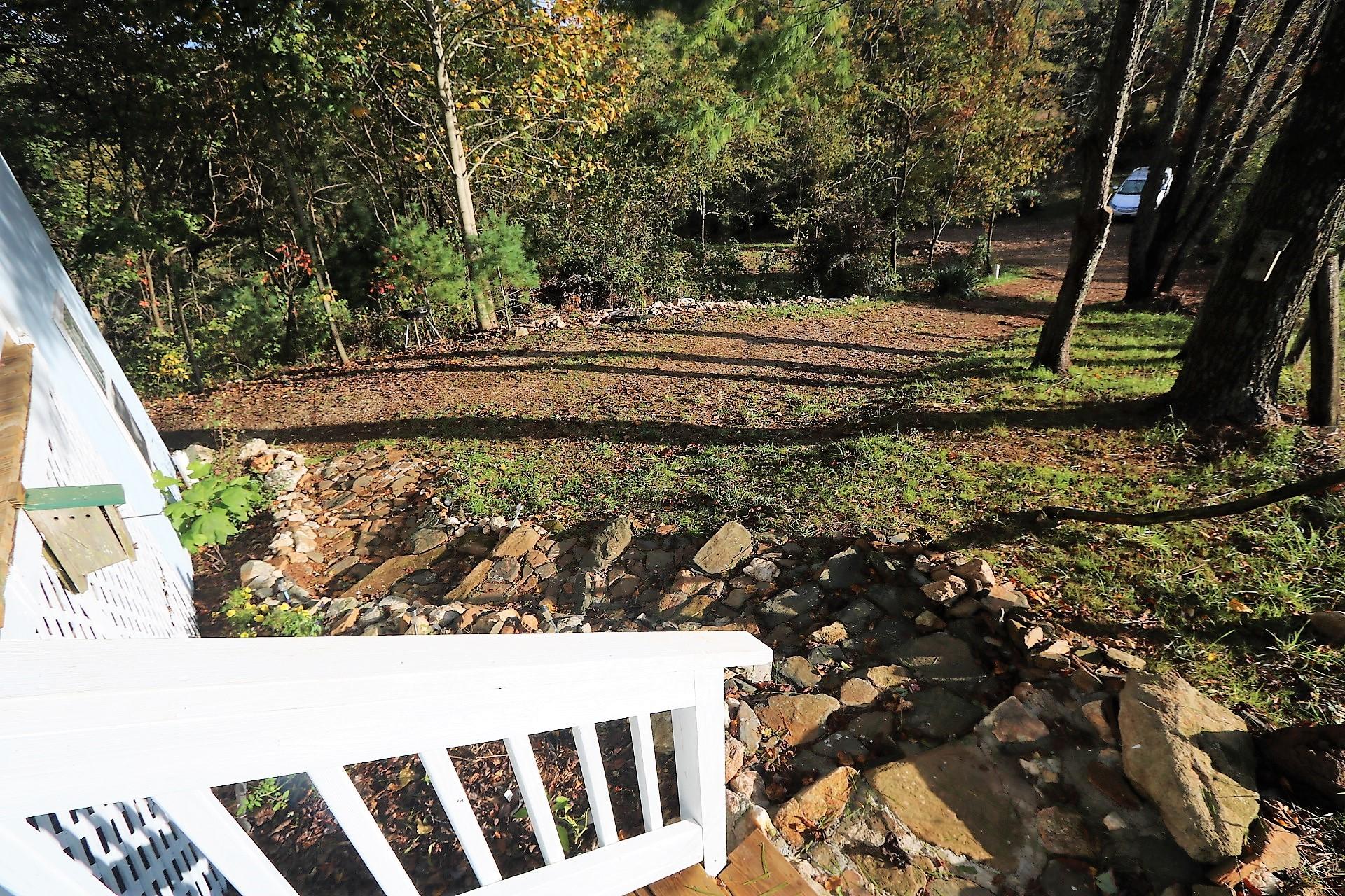 174 Spring Dale Road Southwest Floyd, VA 24091 - Photo 35 of 37 a view of a backyard with wooden fence and trees