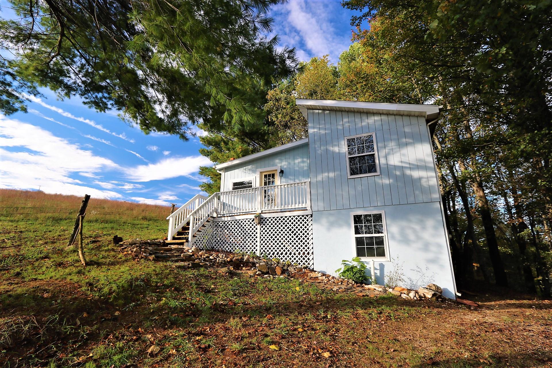 174 Spring Dale Road Southwest Floyd, VA 24091 - Photo 5 of 37 a front view of a house with a yard