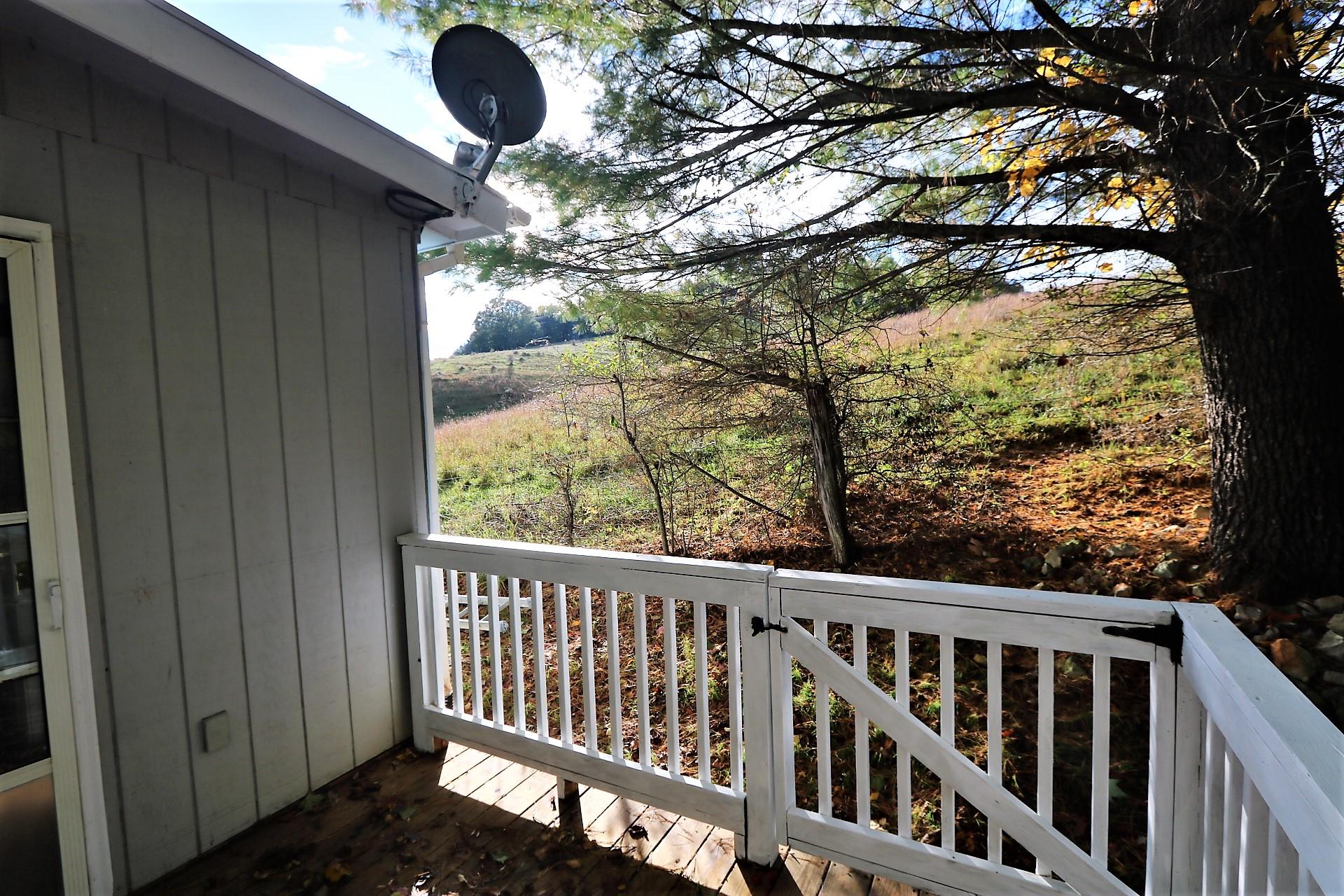 174 Spring Dale Road Southwest Floyd, VA 24091 - Photo 7 of 37 a view of balcony with wooden floor