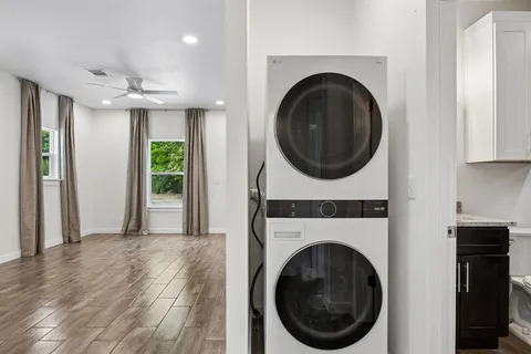 a view of a hallway with washer and dryer