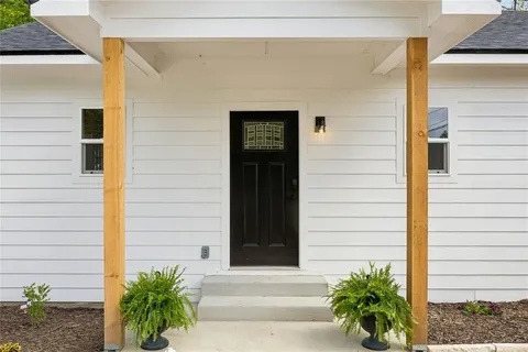 a front view of a house with a garage