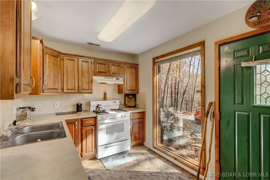 16376 Twisted Tree Road Barnett, MO 65011 - Photo 7 of 48 Large window & stained glass entry door!