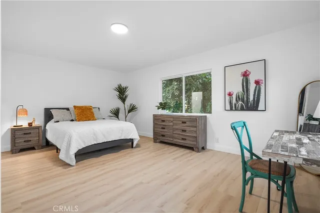 a bedroom with a bed and furniture