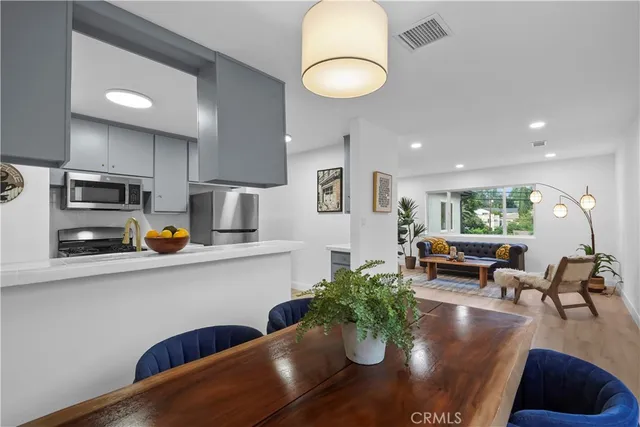 a view of kitchen and dining room with wooden floor
