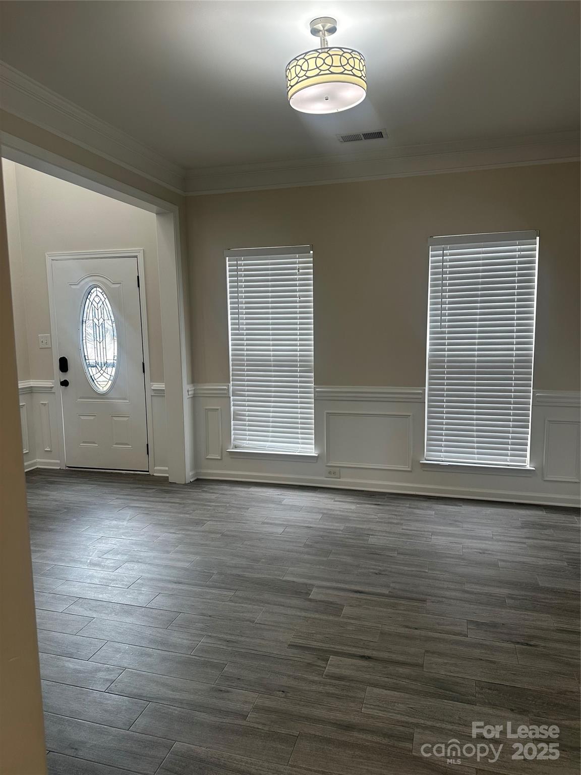 618 Circle Trace Road Monroe, NC 28110 - Photo 12 of 21 an empty room with wooden floor and windows
