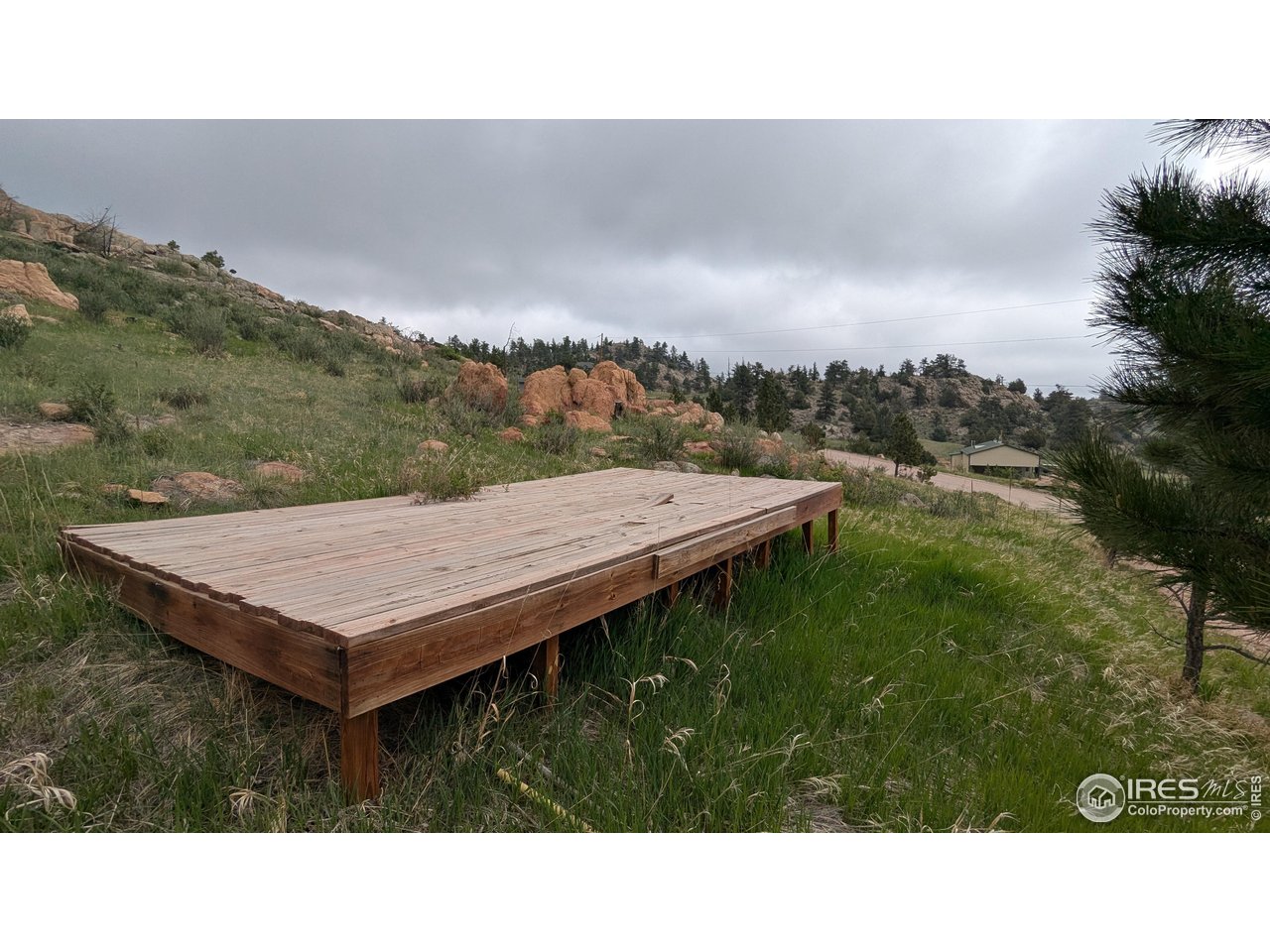 1191 Eiger Road Livermore, CO 80536 - Photo 6 of 17 a balcony with a table and chairs