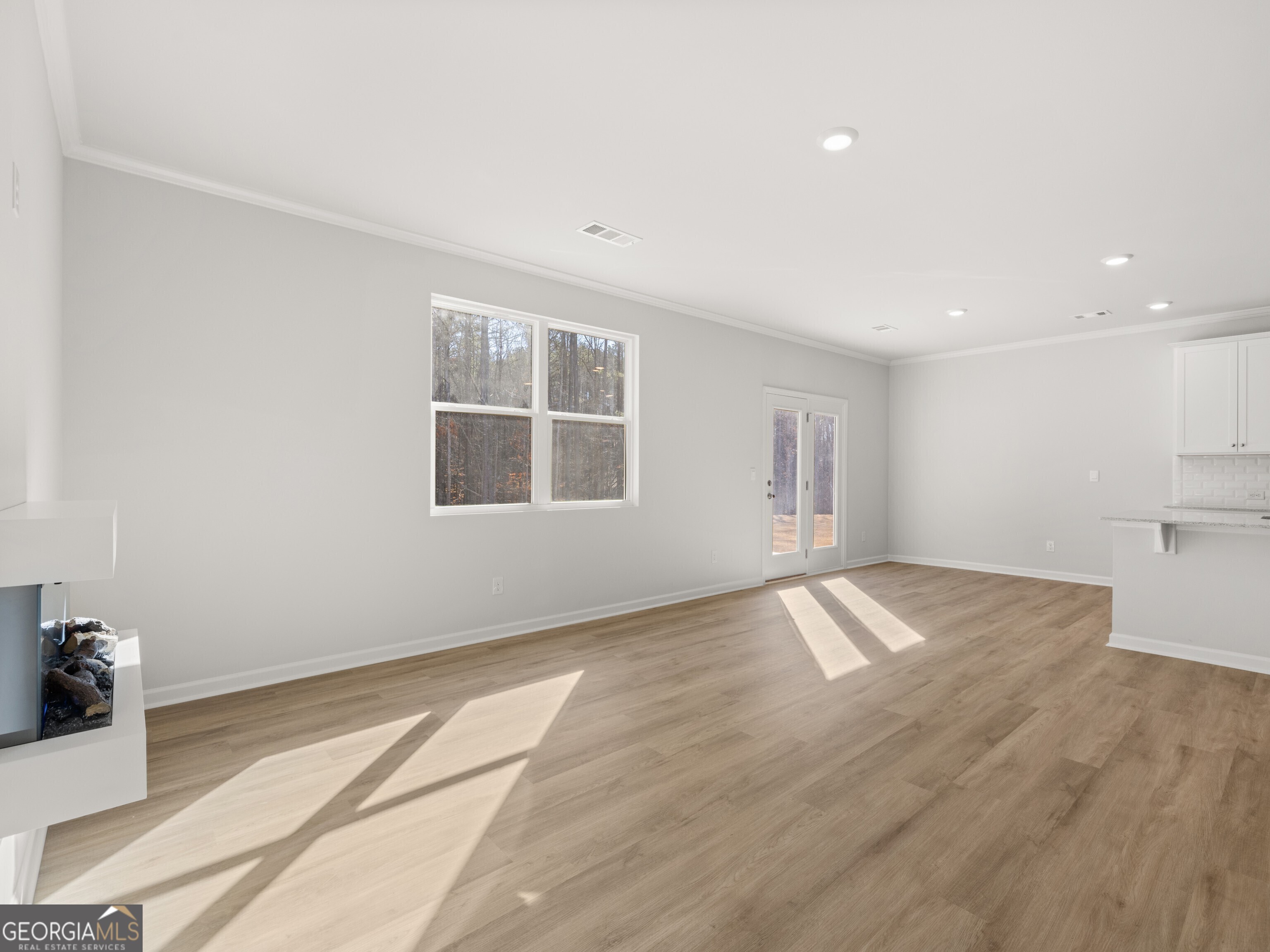 156 Hampton Drive Dallas, GA 30132 - Photo 18 of 81 a view of empty room with wooden floor and fan