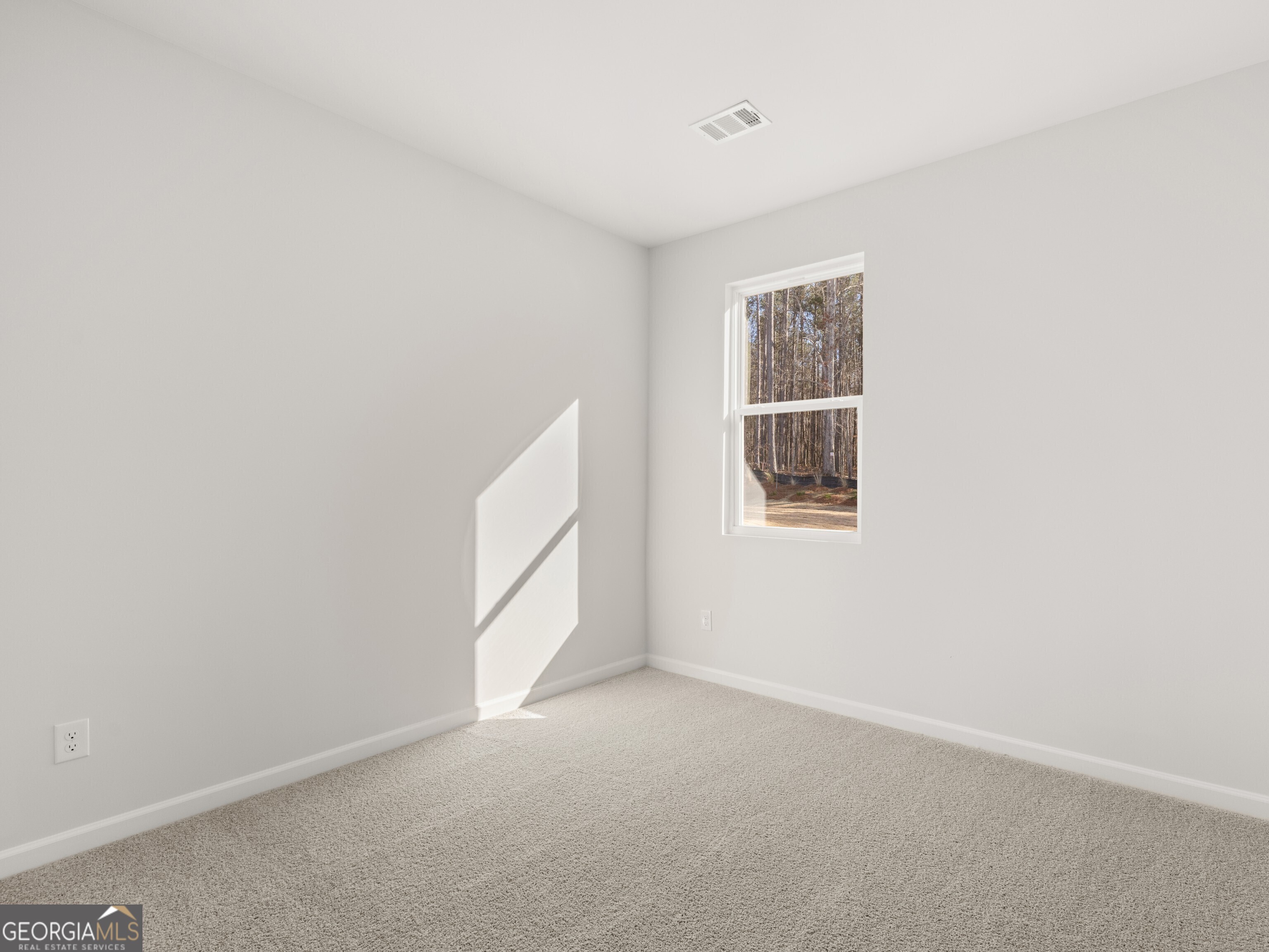 156 Hampton Drive Dallas, GA 30132 - Photo 19 of 81 a view of an empty room with a window