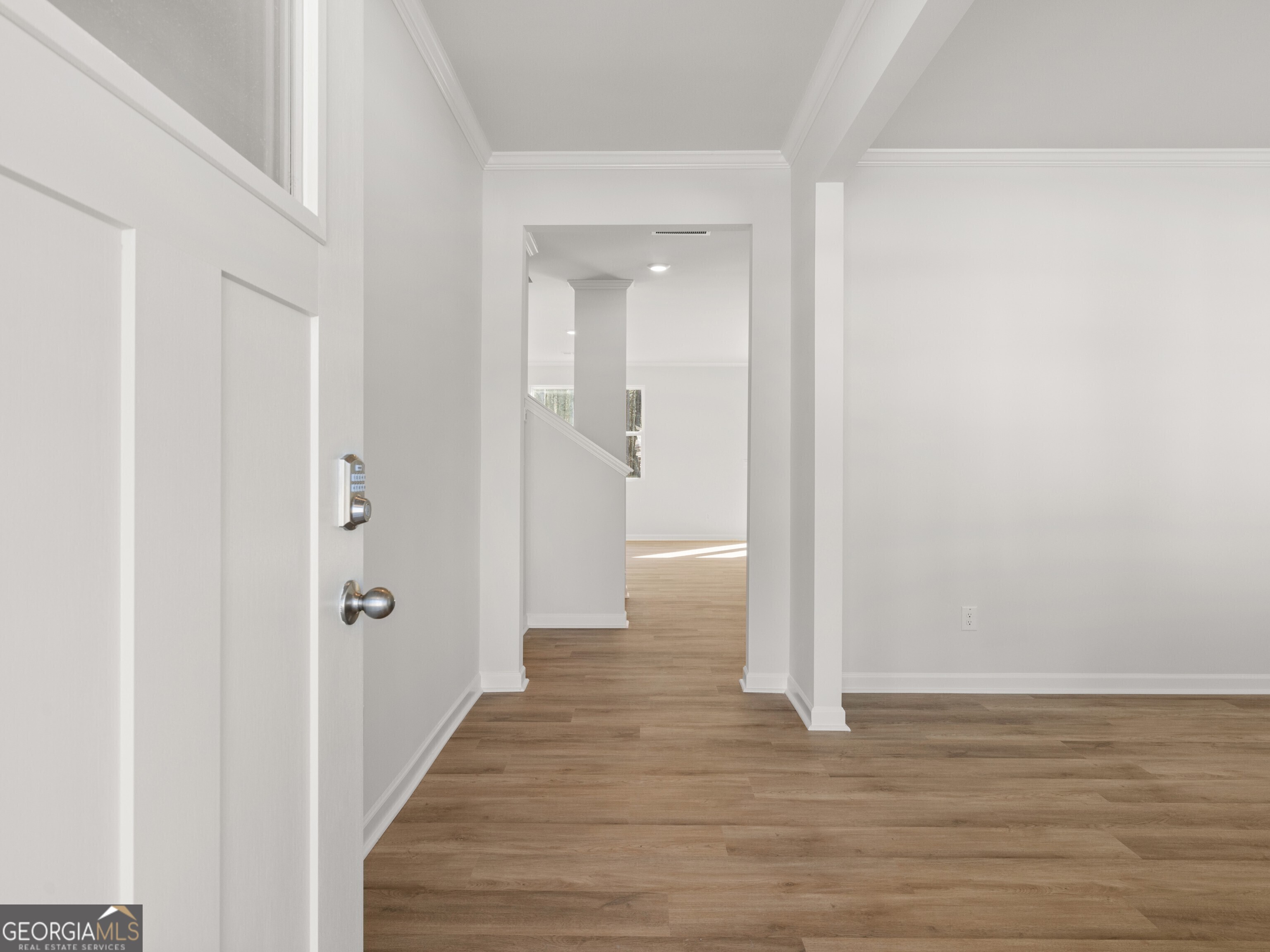 156 Hampton Drive Dallas, GA 30132 - Photo 2 of 81 a view of a hallway with wooden floor
