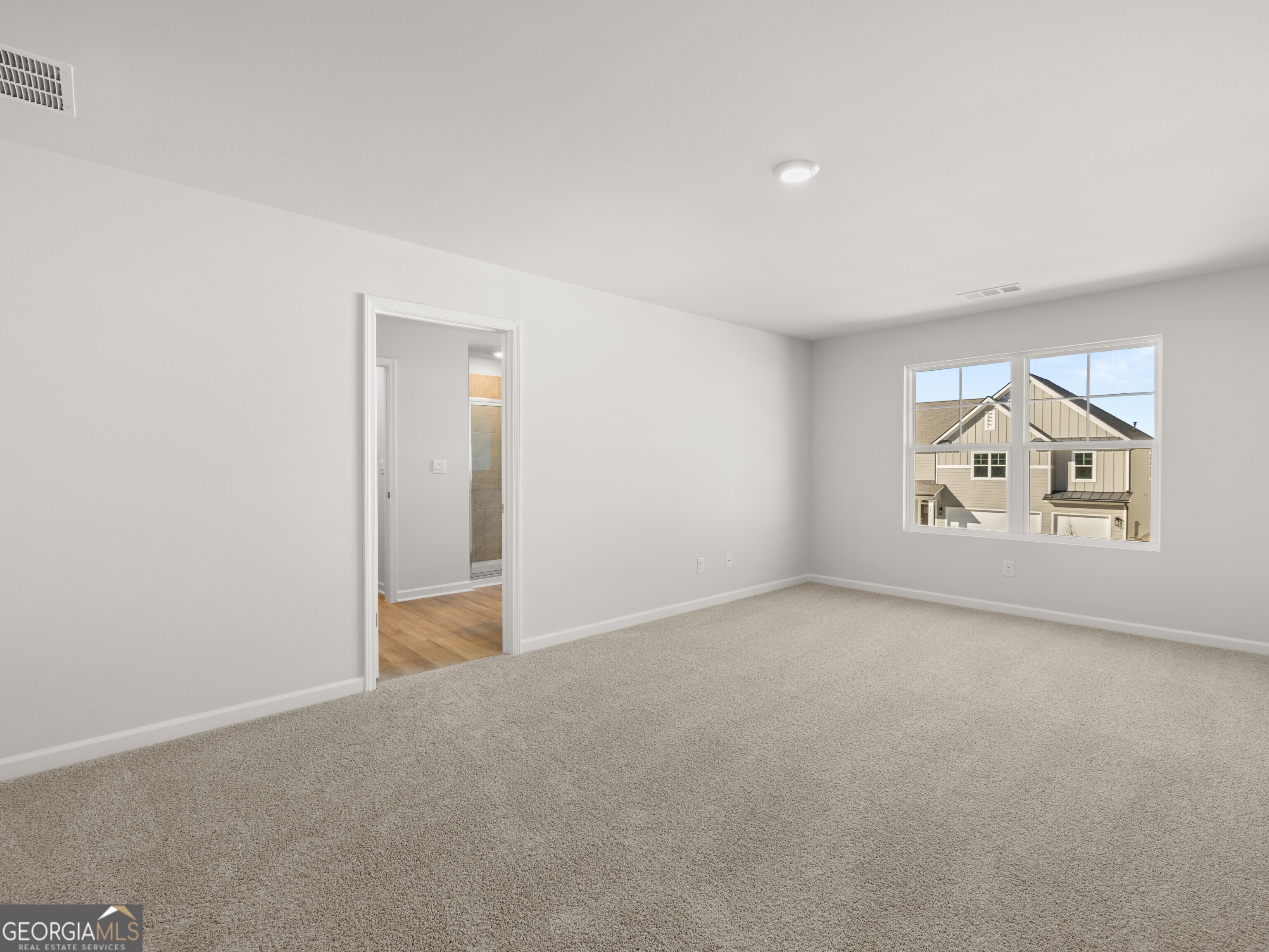 156 Hampton Drive Dallas, GA 30132 - Photo 24 of 81 a view of an empty room and wooden floor
