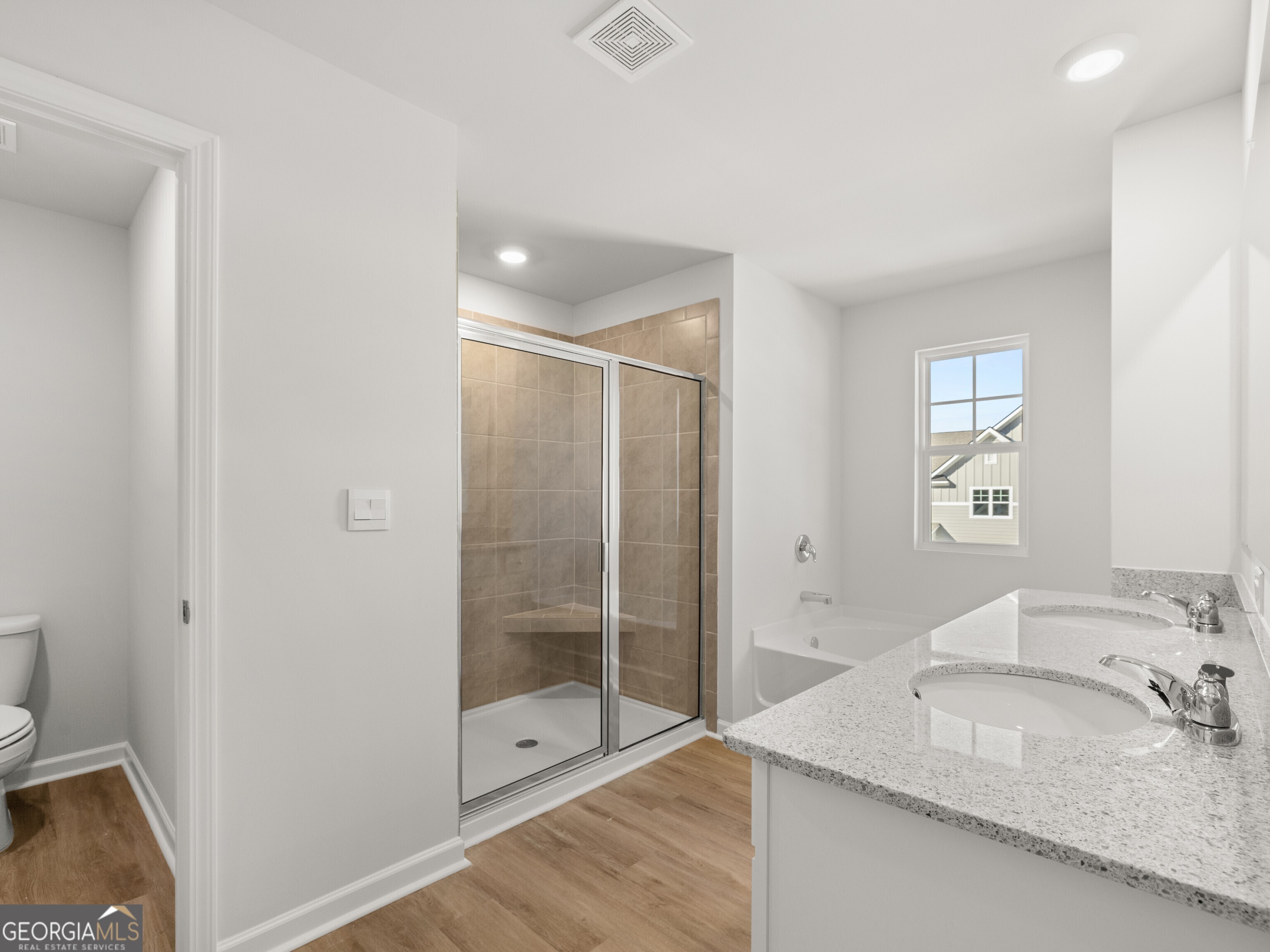 156 Hampton Drive Dallas, GA 30132 - Photo 26 of 81 a bathroom with a granite countertop sink a mirror and shower