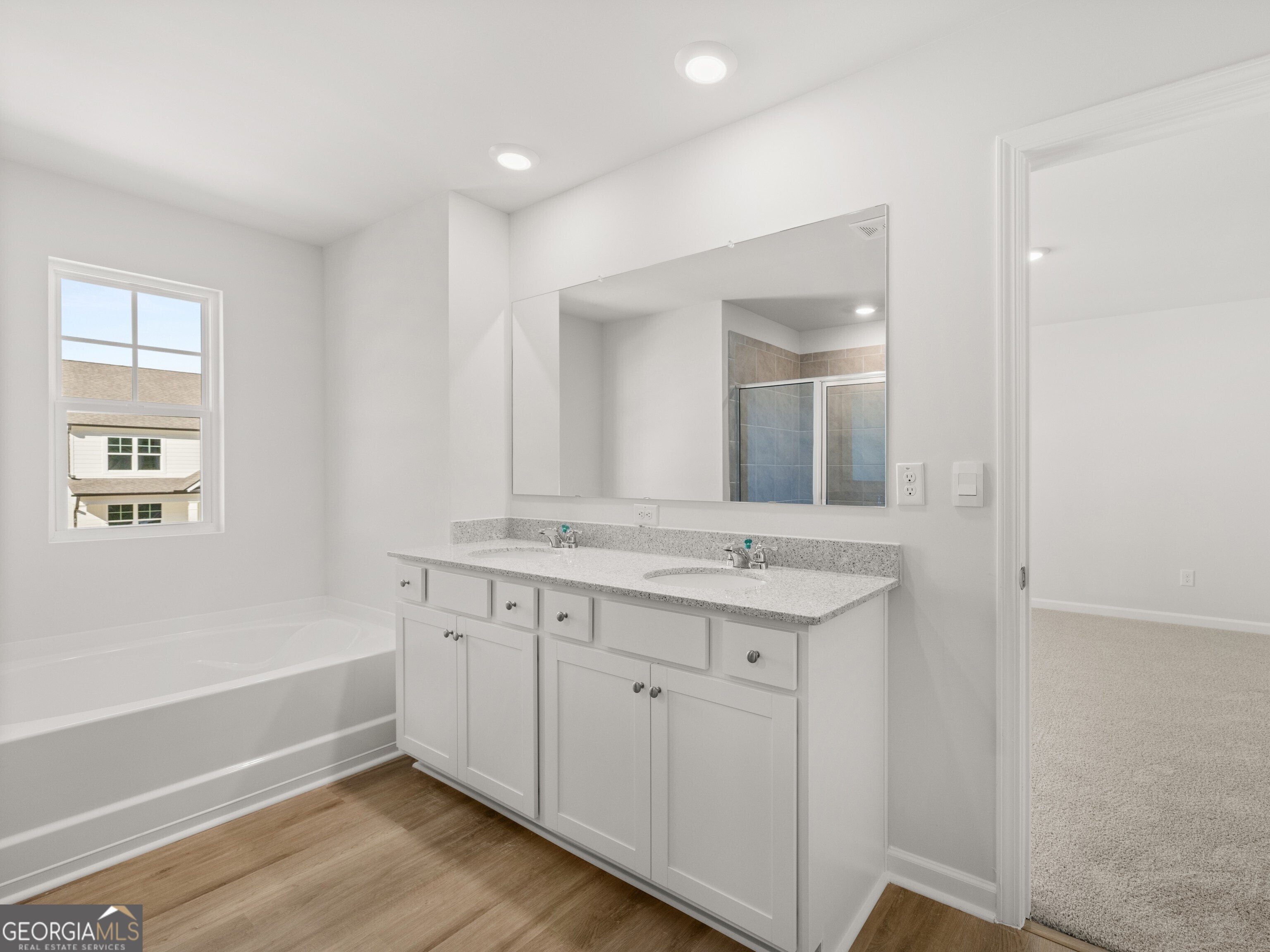 156 Hampton Drive Dallas, GA 30132 - Photo 27 of 81 a bathroom with a granite countertop sink mirror and bathtub