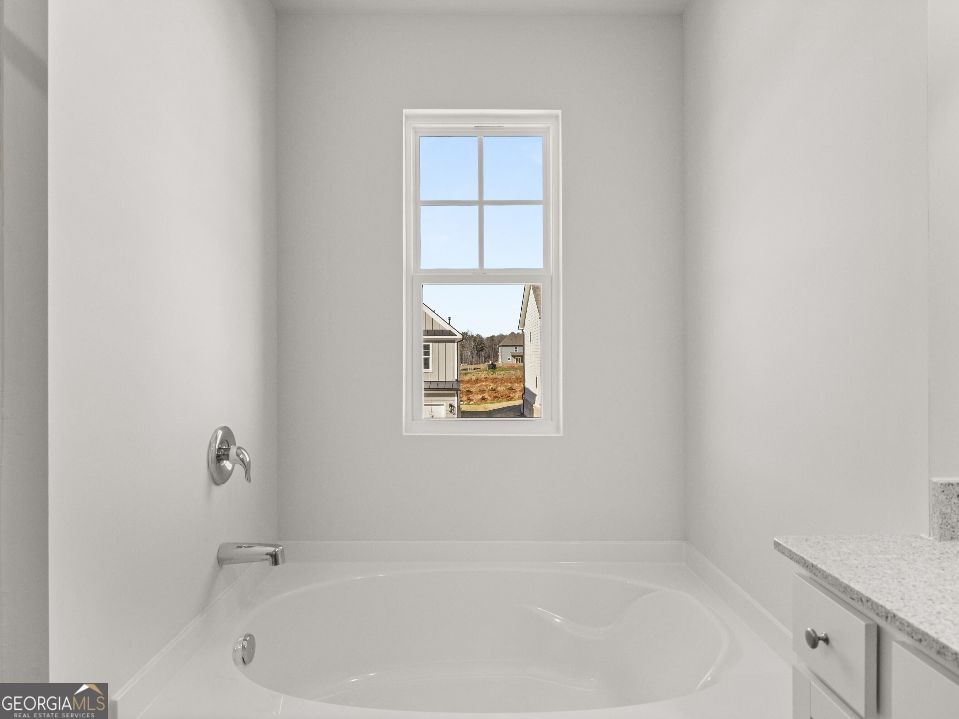 156 Hampton Drive Dallas, GA 30132 - Photo 29 of 81 a white bath tub sitting in a bathroom