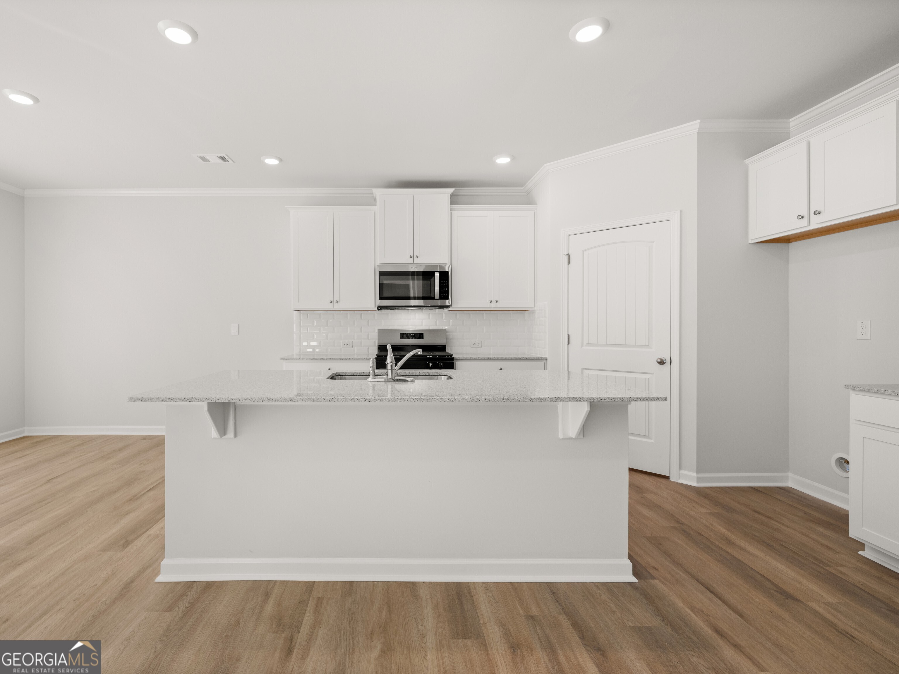 156 Hampton Drive Dallas, GA 30132 - Photo 6 of 81 a view of kitchen with wooden floor