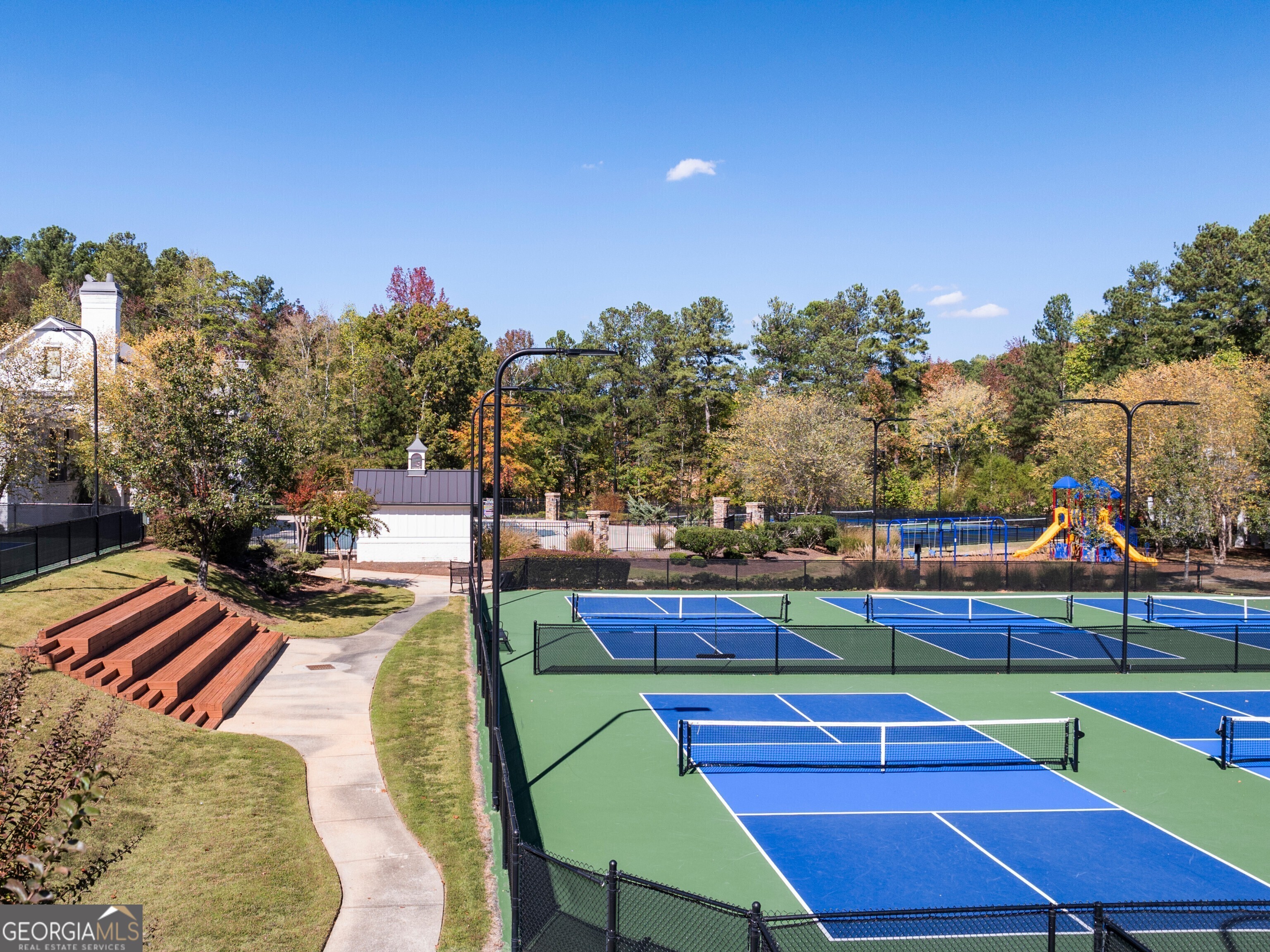 156 Hampton Drive Dallas, GA 30132 - Photo 71 of 81 a view of a tennis ground with large trees