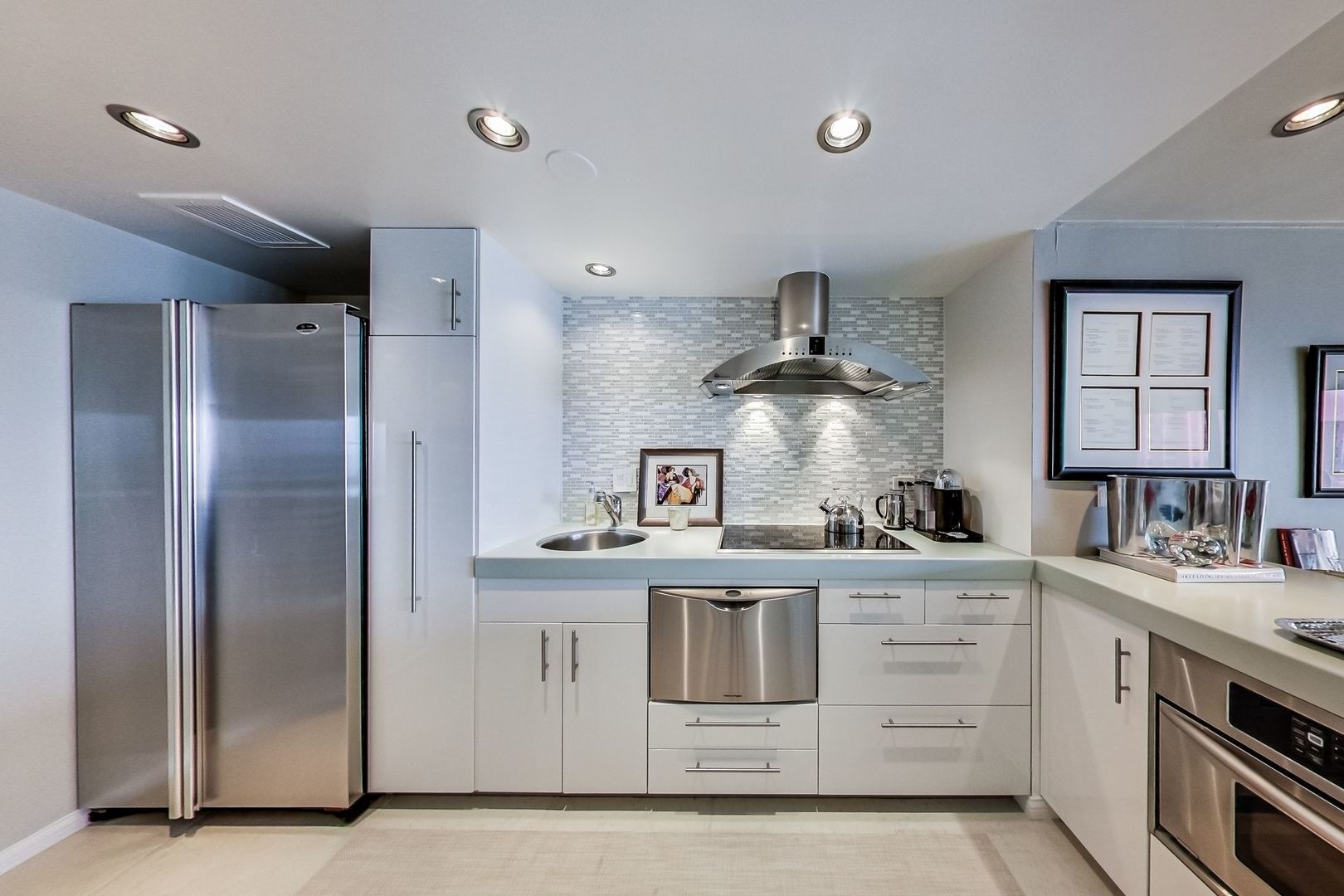 175 East Delaware Place, Unit 5819 Chicago, IL 60611 - Photo 5 of 22 a kitchen with a stove sink and refrigerator