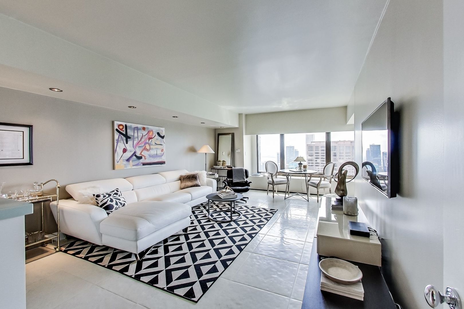 175 East Delaware Place, Unit 5819 Chicago, IL 60611 - Photo 9 of 22 a living room with furniture and a large window