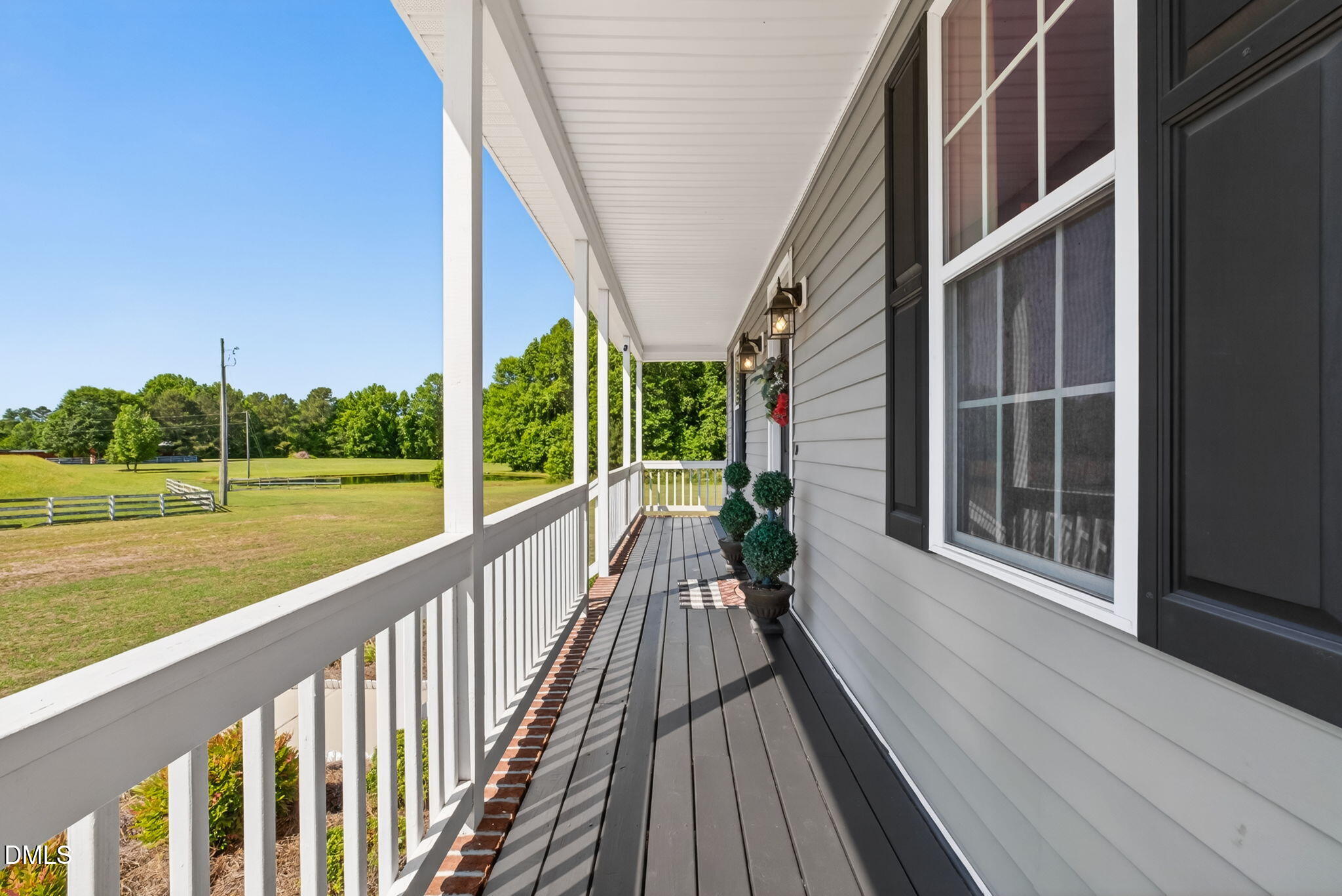923 White Memorial Church Road Willow Spring, NC 27592 - Photo 10 of 46 a view of balcony with yard