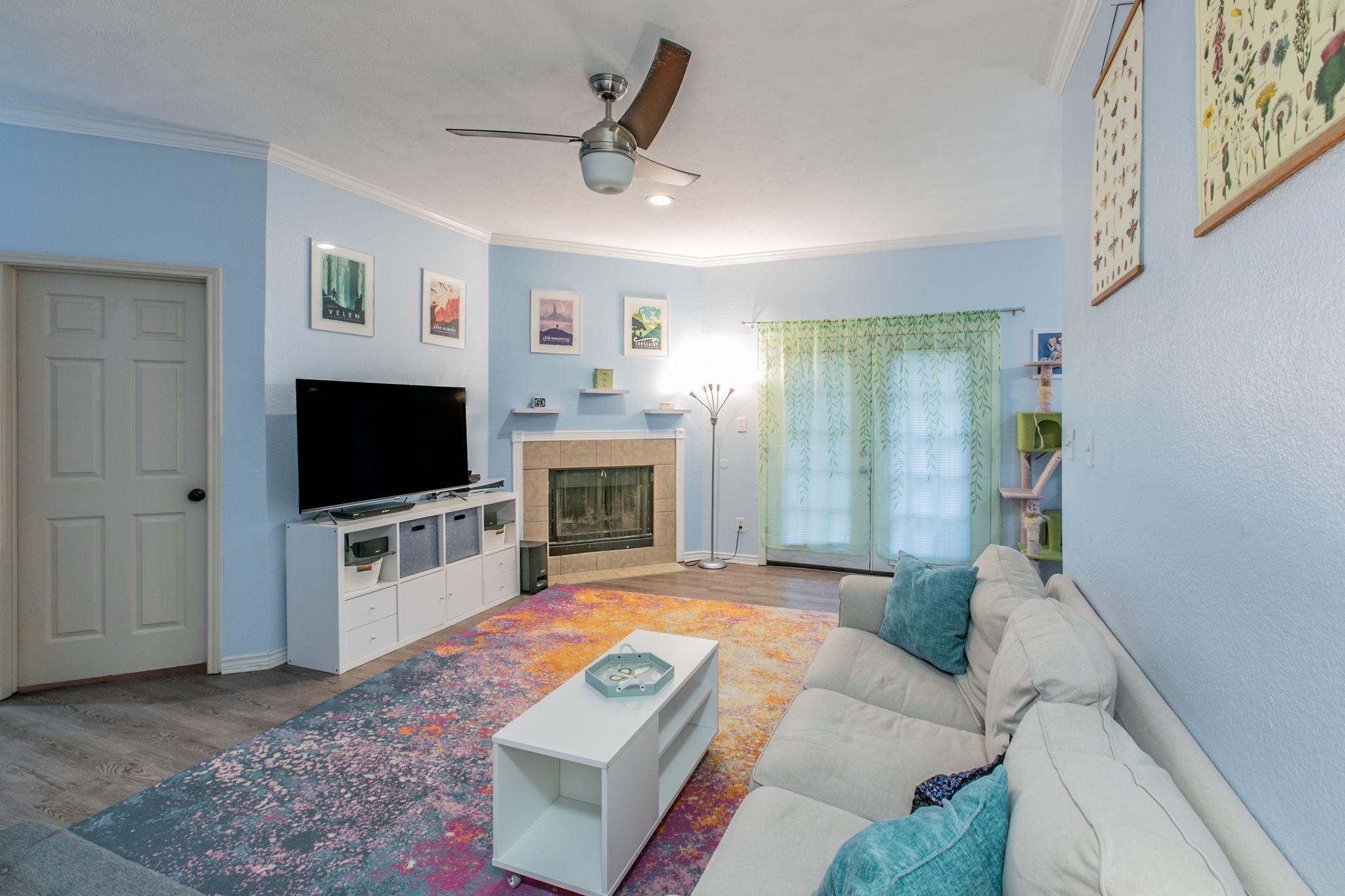 1005 North LBJ Drive, Unit B2 San Marcos, TX 78666 - Photo 1 of 19 a living room with furniture and a flat screen tv