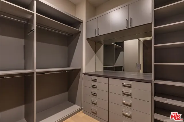 a bathroom with a shower and a mirror