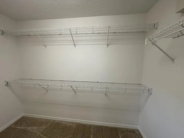 a view of a room with racks on the wall