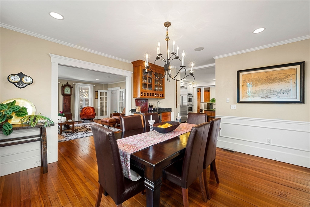 23 Wyman Road Marblehead, MA 01945 - Photo 14 of 42 a view of a dining room with furniture wooden floor and chandelier