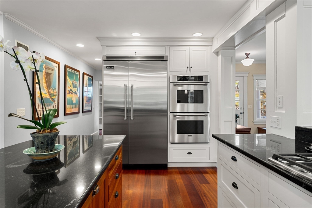 23 Wyman Road Marblehead, MA 01945 - Photo 17 of 42 a kitchen with stainless steel appliances a refrigerator a stove a sink and a potted plant
