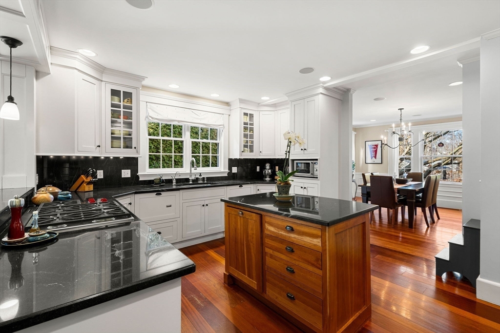 23 Wyman Road Marblehead, MA 01945 - Photo 18 of 42 a kitchen with stainless steel appliances granite countertop a stove a sink and a refrigerator