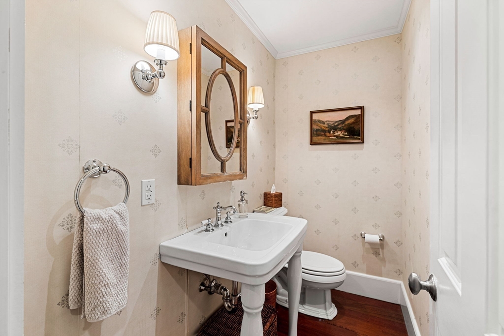 23 Wyman Road Marblehead, MA 01945 - Photo 24 of 42 a bathroom with a sink mirror and toilet