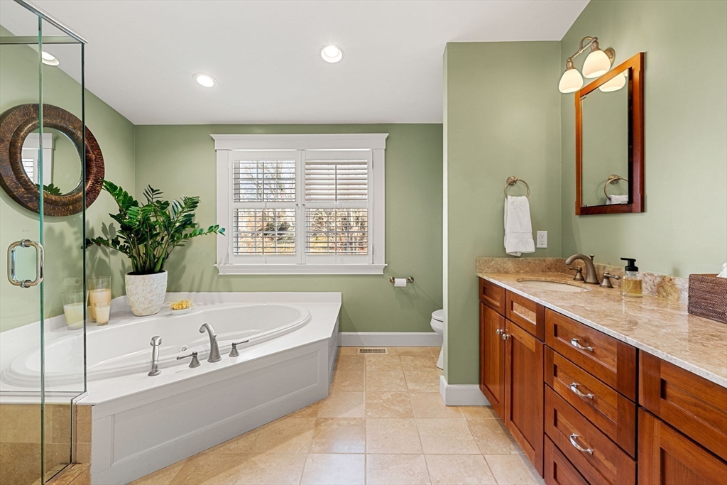 23 Wyman Road Marblehead, MA 01945 - Photo 27 of 42 a spacious bathroom with a tub sink and mirror