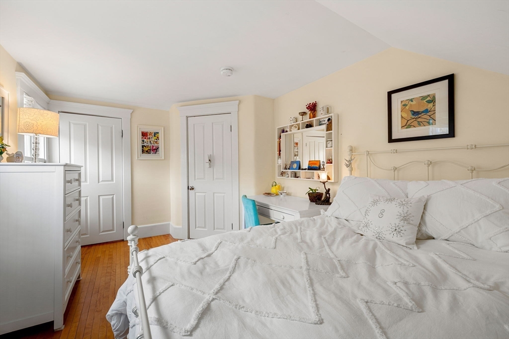 23 Wyman Road Marblehead, MA 01945 - Photo 30 of 42 a bedroom with a bed and a couch