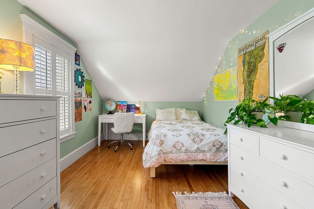 23 Wyman Road Marblehead, MA 01945 - Photo 32 of 42 a bedroom with a bed and wooden floor