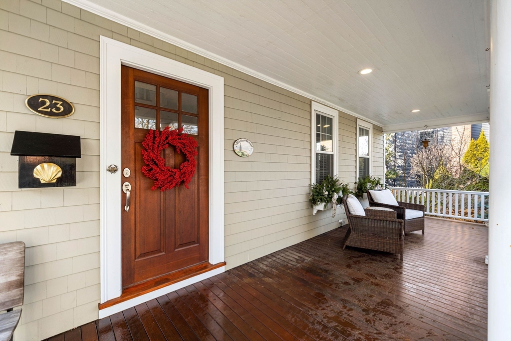23 Wyman Road Marblehead, MA 01945 - Photo 4 of 42 a porch with a bench and a couch