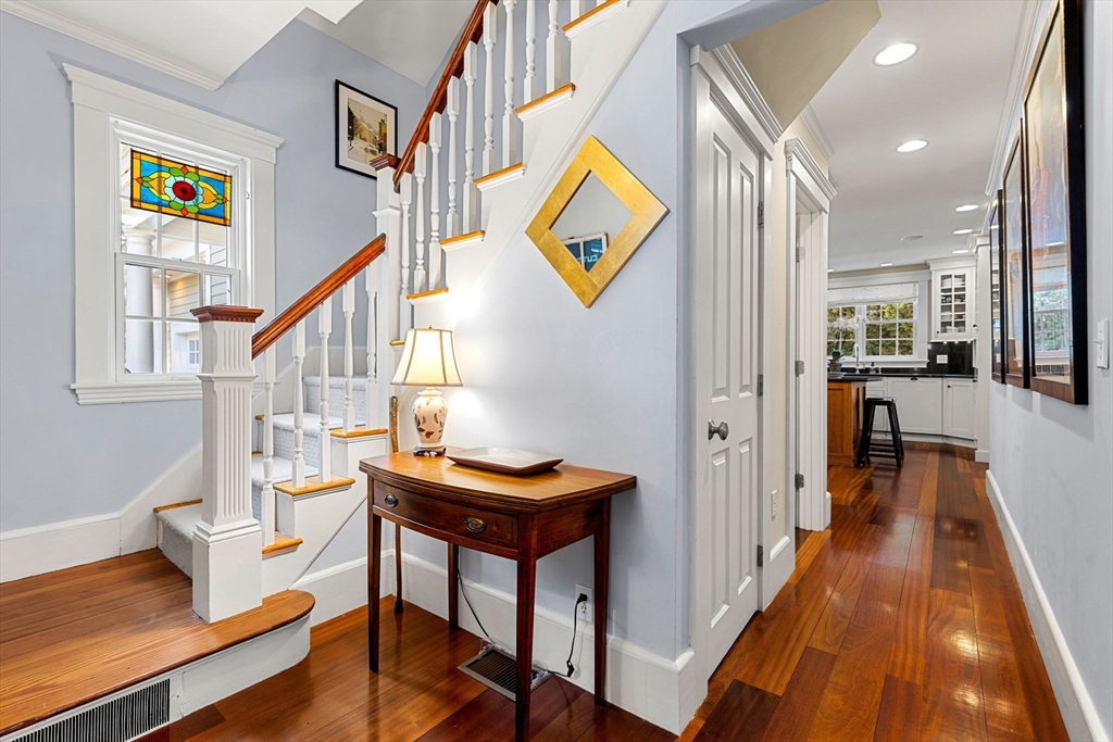 23 Wyman Road Marblehead, MA 01945 - Photo 6 of 42 a view of a livingroom with furniture a dinning room and stairs