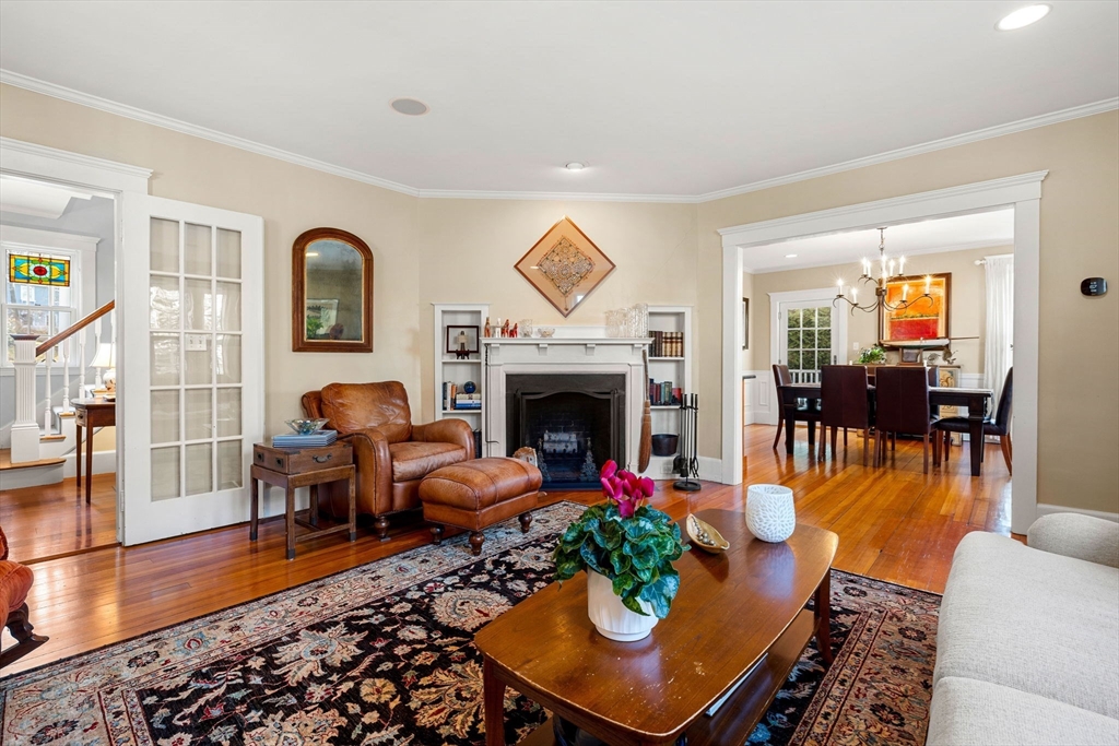 23 Wyman Road Marblehead, MA 01945 - Photo 8 of 42 a living room with furniture a fireplace and a table