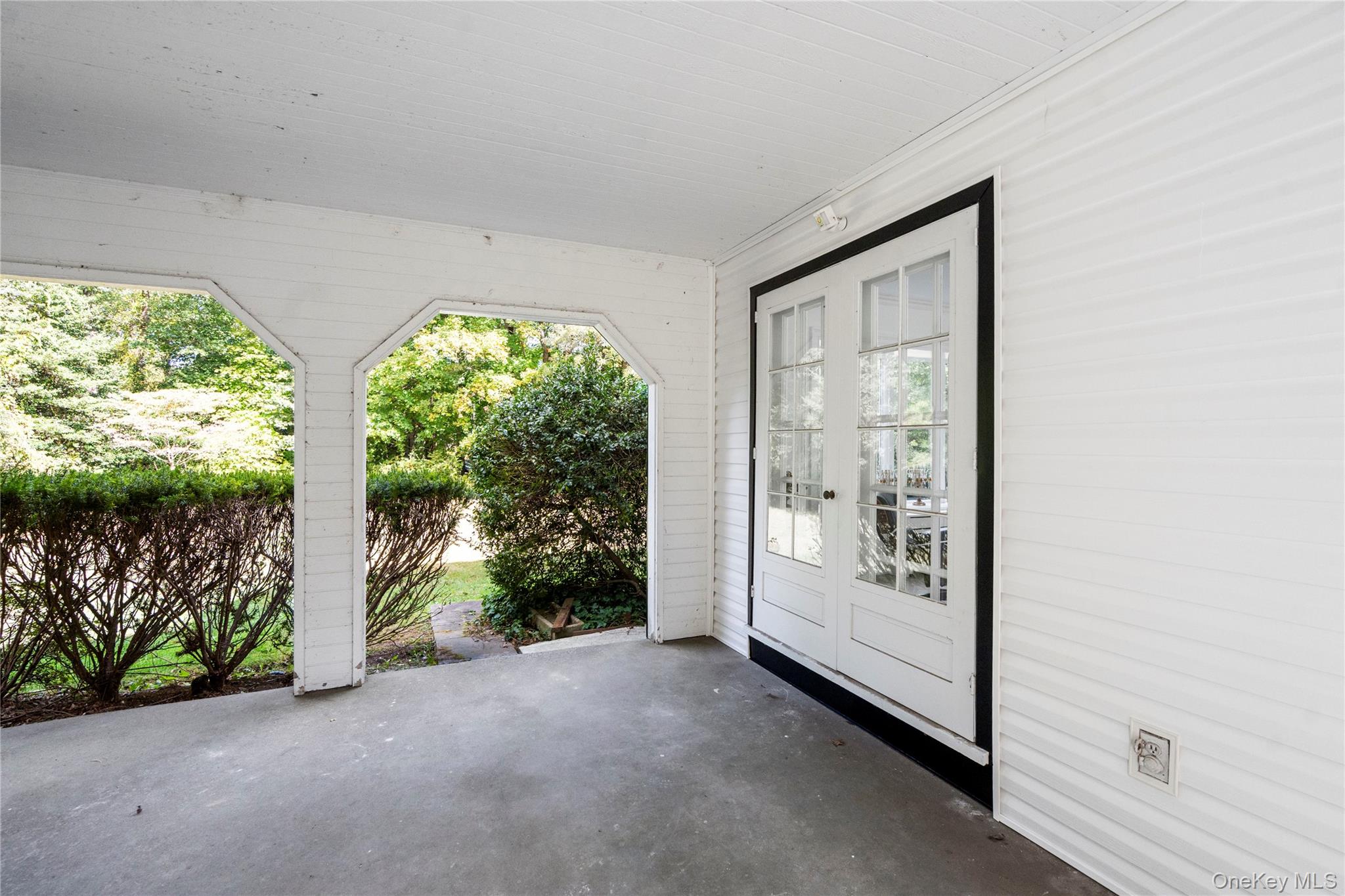897 Ripley Lane Muttontown, NY 11771 - Photo 12 of 45 French Doors from Living Room that open to Loggia
