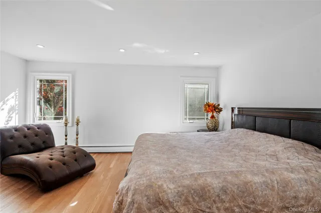 a bedroom with a bed and a couch