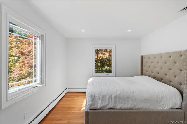 a bedroom with bed and window