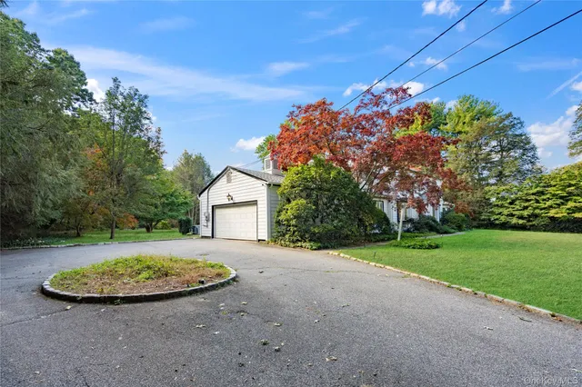 a view of house with outdoor space and street view