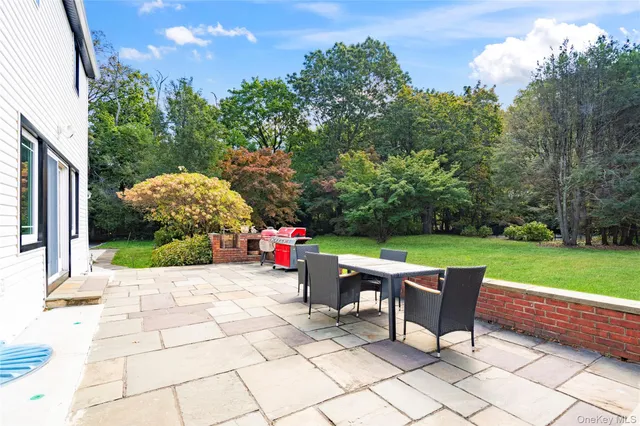 a view of a field of grass and trees
