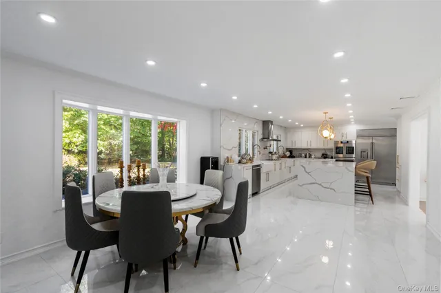 a view of a dining area with furniture window and outside view