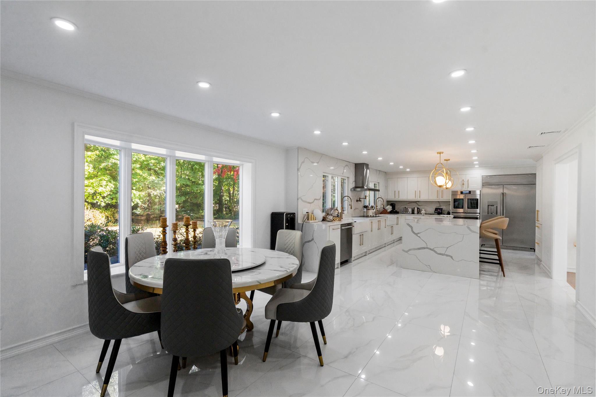 897 Ripley Lane Muttontown, NY 11771 - Photo 7 of 45 Waterfall center island with sleek finishes