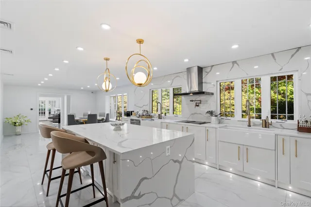 a kitchen with appliances a sink and cabinets