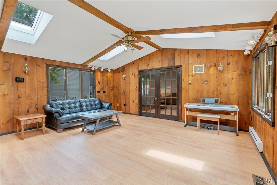 8069 Princess Path Clay, NY 13090 - Photo 22 of 50 The knotty pine walls also add a feel of warmth to