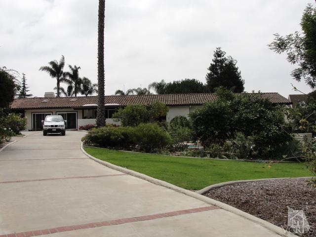 522 Avocado Place Camarillo, CA 93010 - Photo 1 of 30 a view of a house with a yard and potted plants