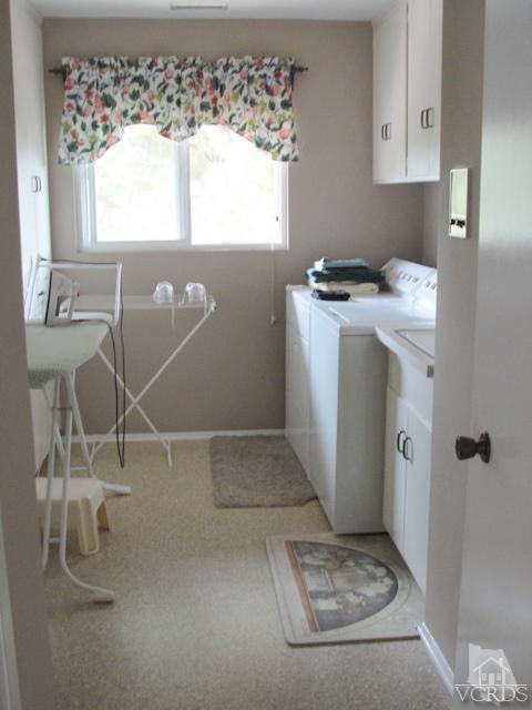 522 Avocado Place Camarillo, CA 93010 - Photo 14 of 30 a utility room with a window dryer and washer