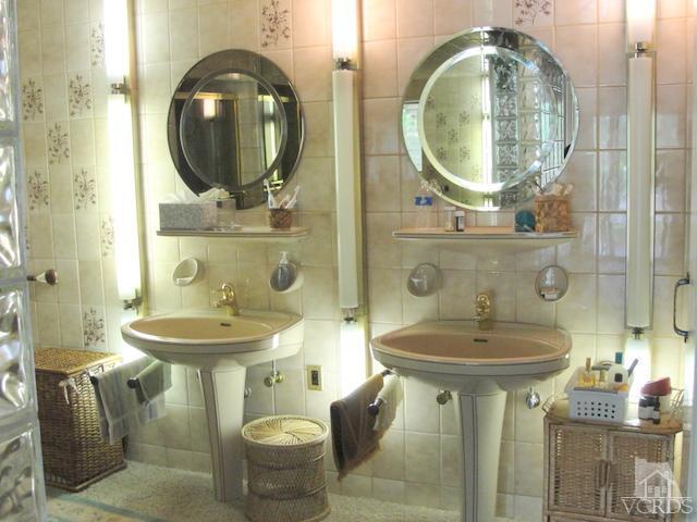 522 Avocado Place Camarillo, CA 93010 - Photo 16 of 30 a bathroom with a sink and mirror