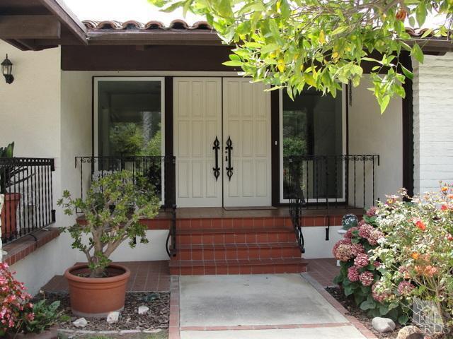 522 Avocado Place Camarillo, CA 93010 - Photo 3 of 30 a potted plant sitting in front of a house with potted plants
