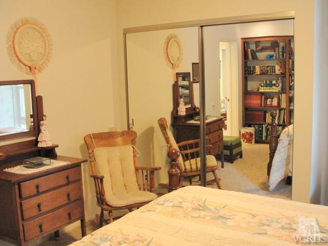 522 Avocado Place Camarillo, CA 93010 - Photo 22 of 30 a bedroom with a bed and wooden floor